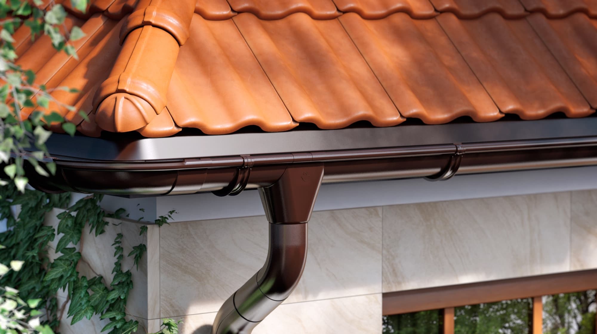 Rynna i rura spustowa GALECO STAL zamontowane na dachu krytym dachówką ceramiczną